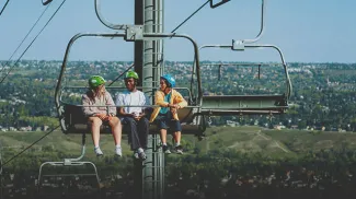 friends riding the chairlift at Downhill Karting