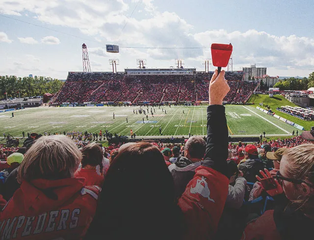 crowd cheering on the Stampeders at McMahon Stadium