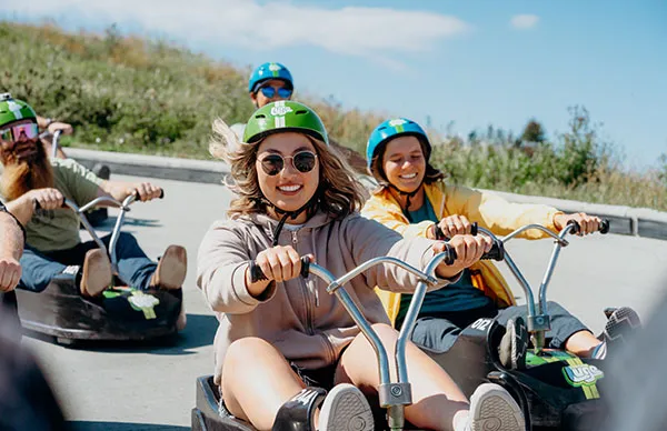a group of people enjoying downhill karting