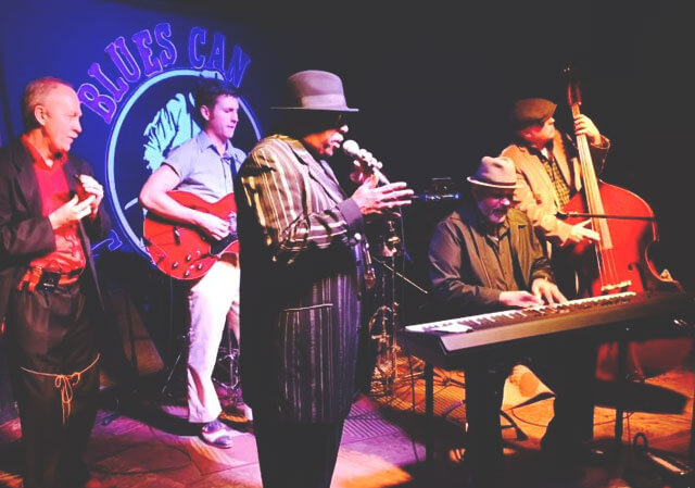 Man playing saxophone at the Blues Can Calgary