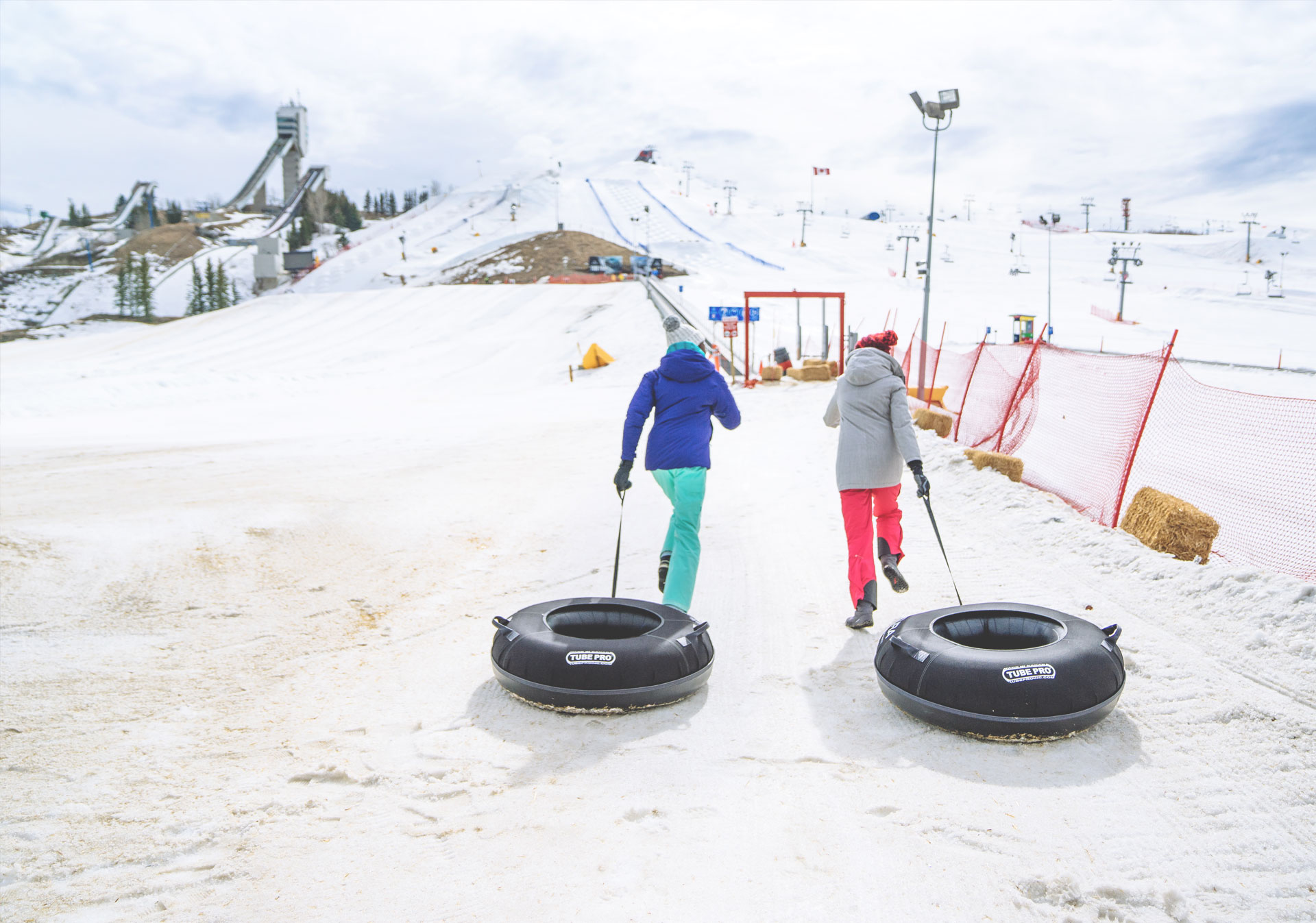 Go tubing at the WinSport Acura Tube Park (Photo credit: Travel Alberta/Steve Tuchiwsky
