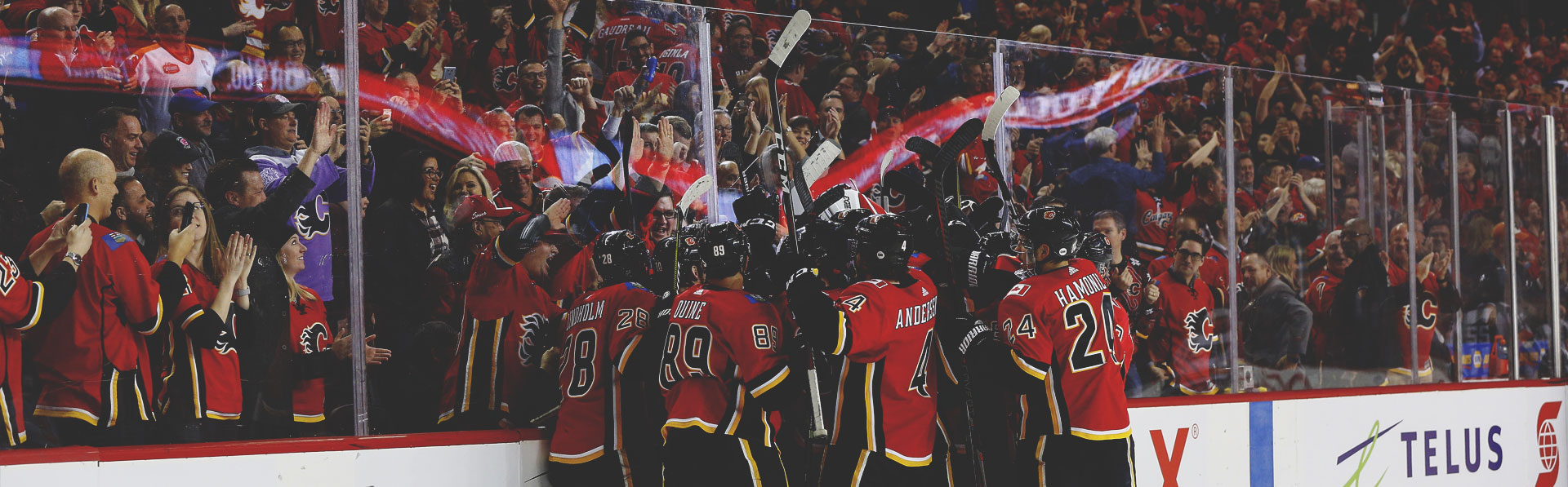 The Calgary Flames celebrating after scoring a goal in Scotiabank Saddledome