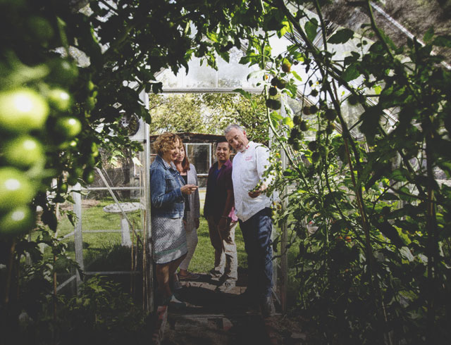 group on a tour of the gardens at Rouge Restaurant