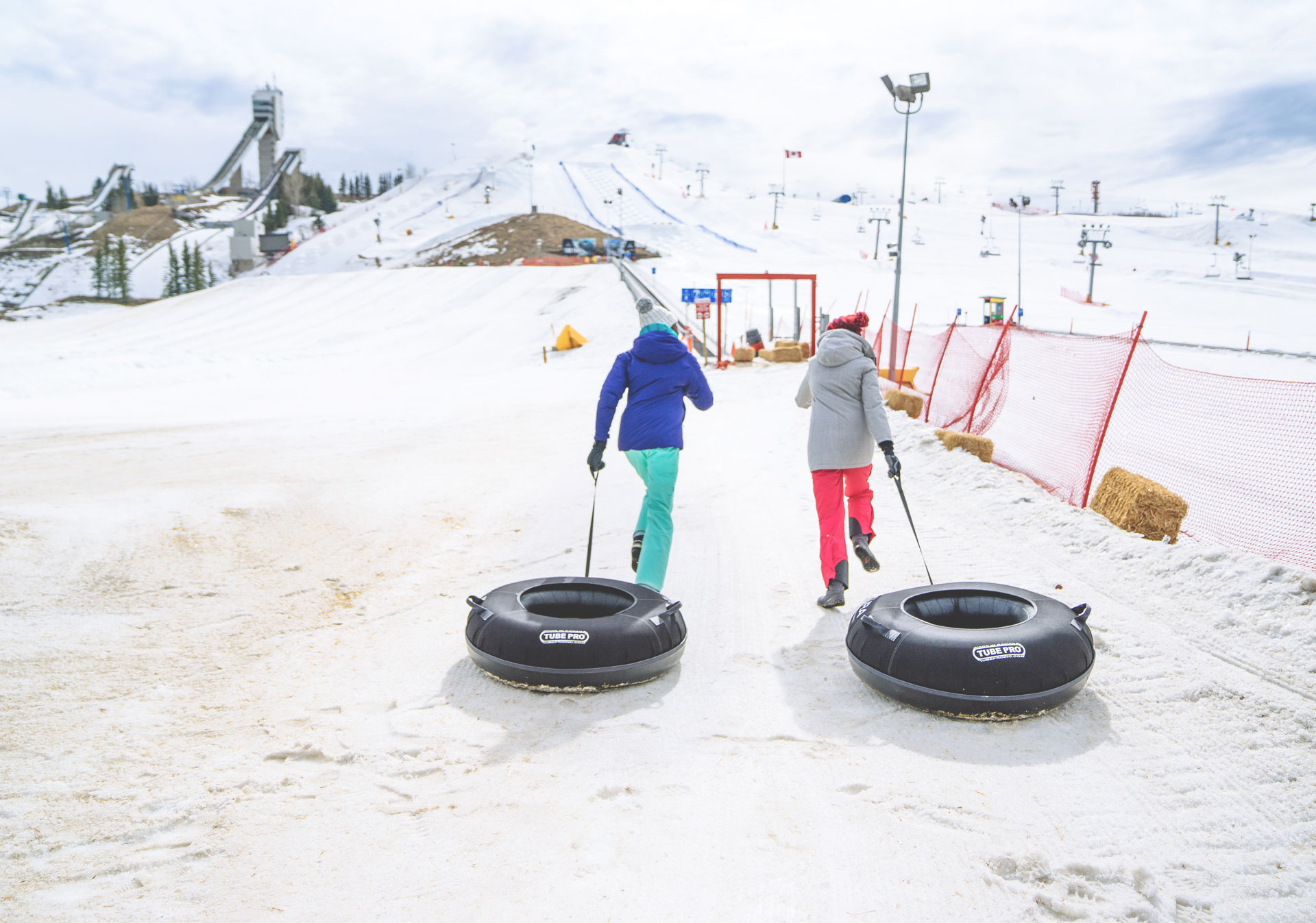 Go tubing at the WinSport Tube Park (Photo credit: Travel Alberta/Steve Tuchiwsky).