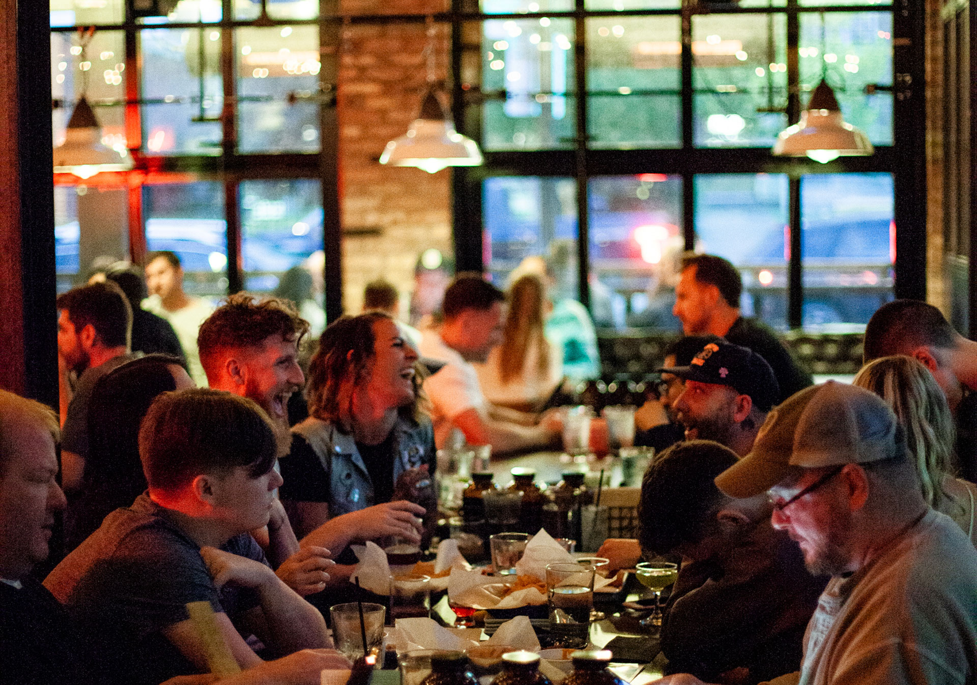 People enjoying the atmosphere inside of Comery Block Barbecue