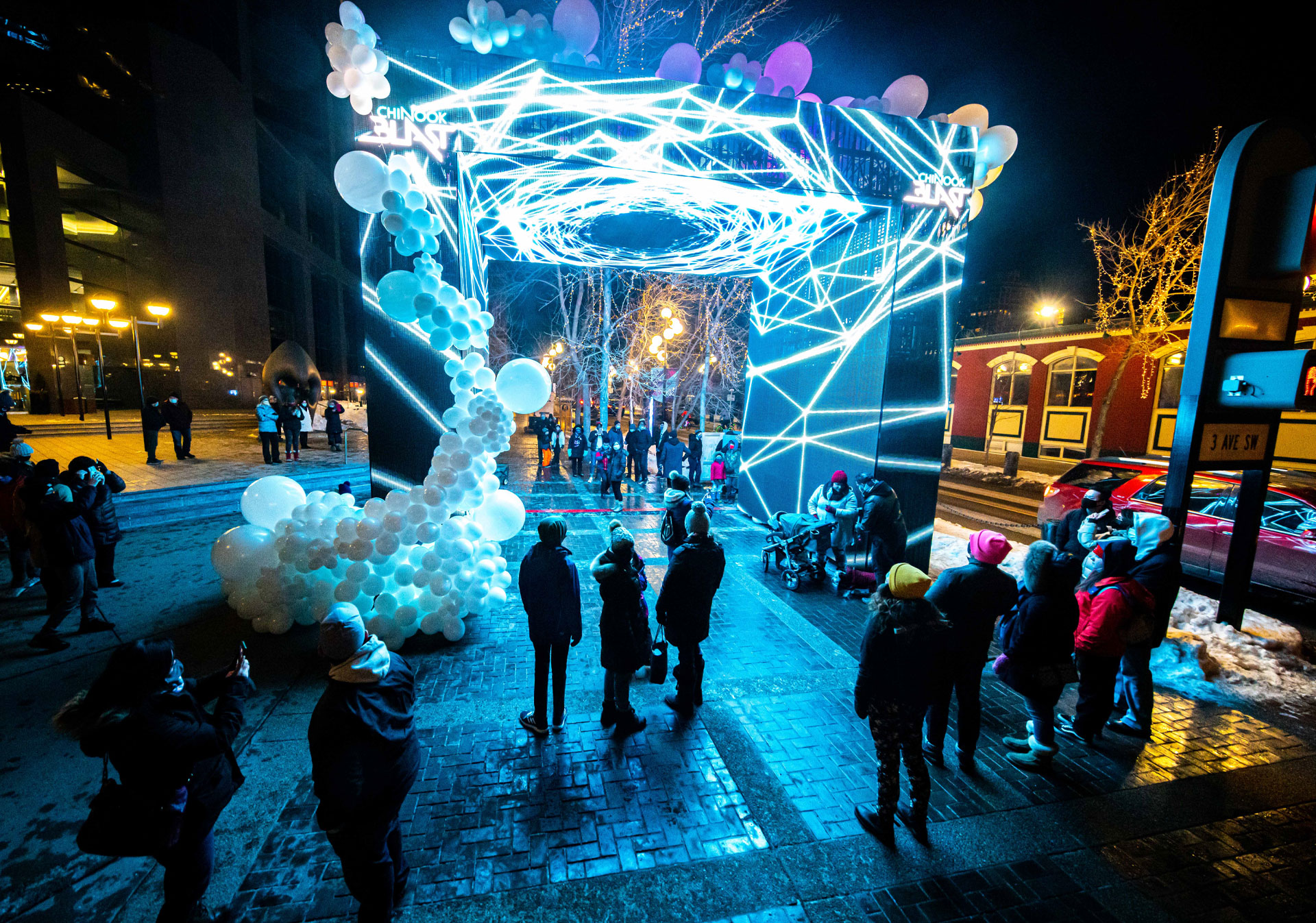 A group of people watching the art installments at Chinook Blast