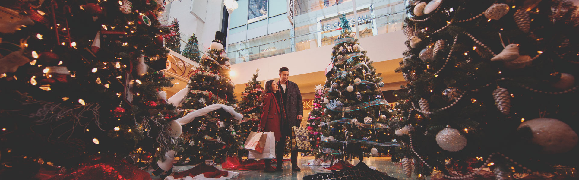 Christmas shopping is the CORE Calgary, surrounded by decorated Christmas trees