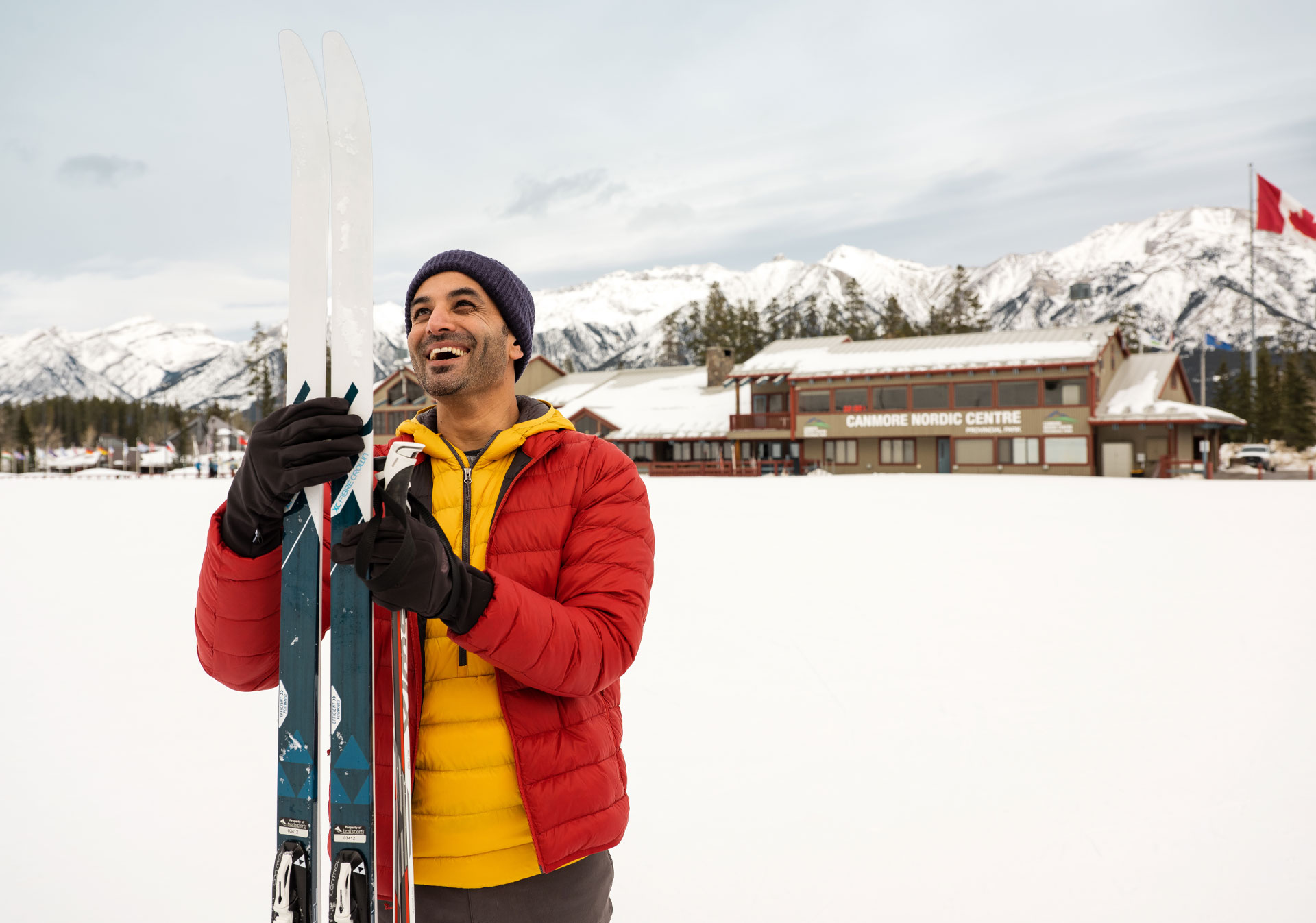 Man getting cross country ski gear at Canmore Nordic Centre