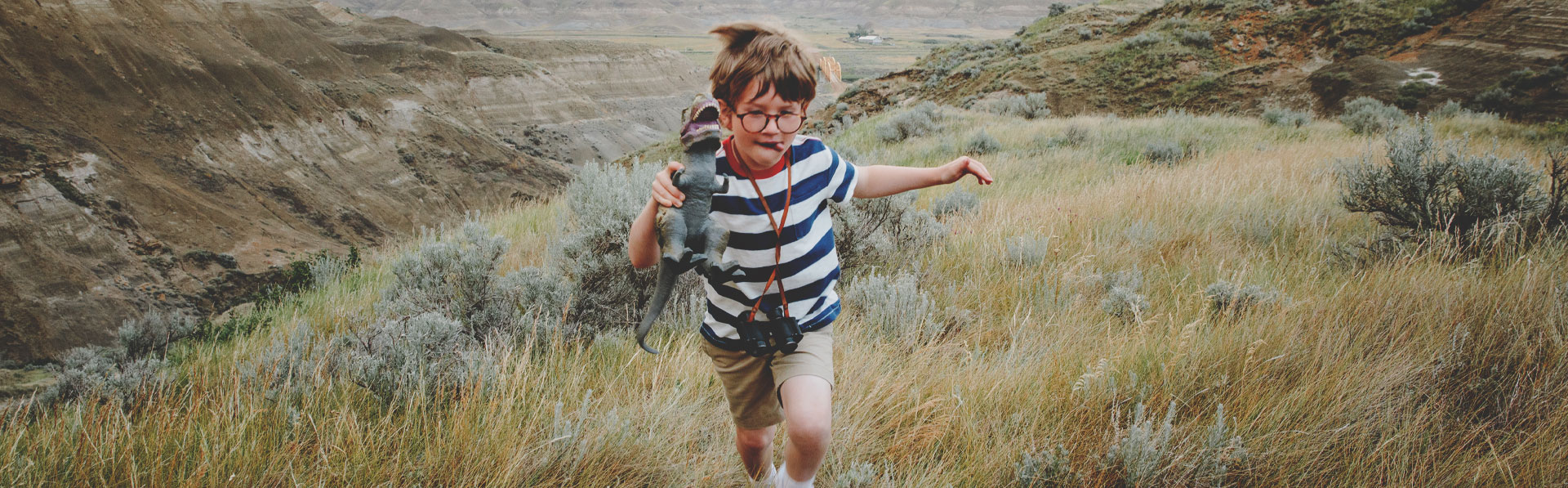 Child looking for dinosaurs in the Alberta Badlands