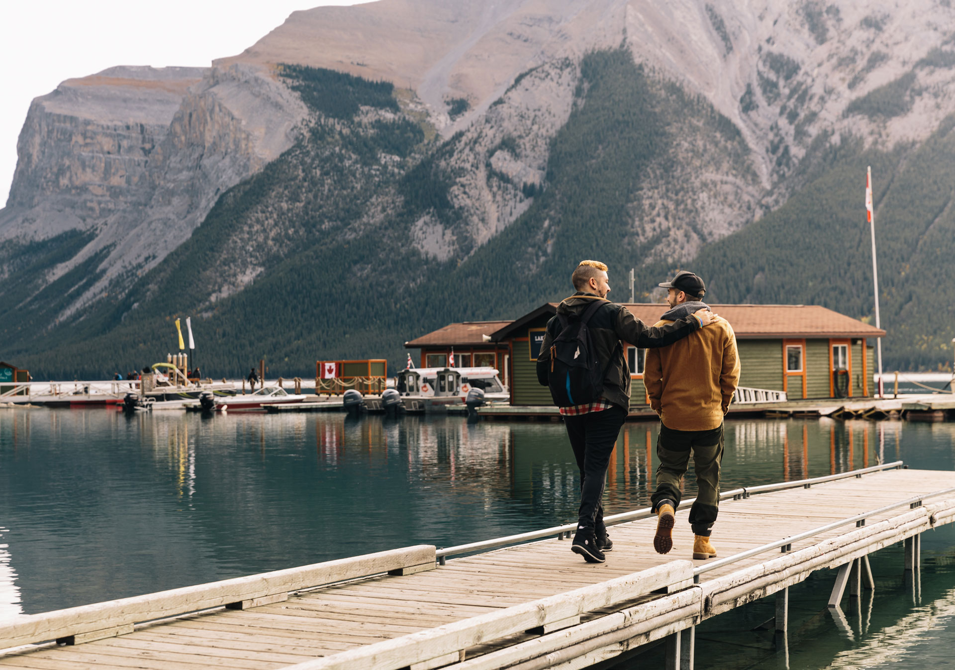 People walking onto the dock at Lake Minnewanka Cruise