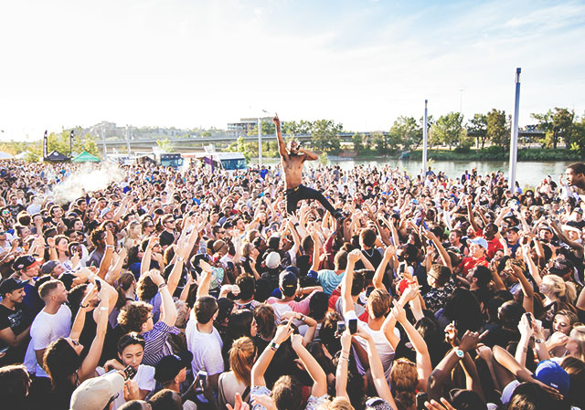 Crowd surrounding a performer at Sled Island Music Festival