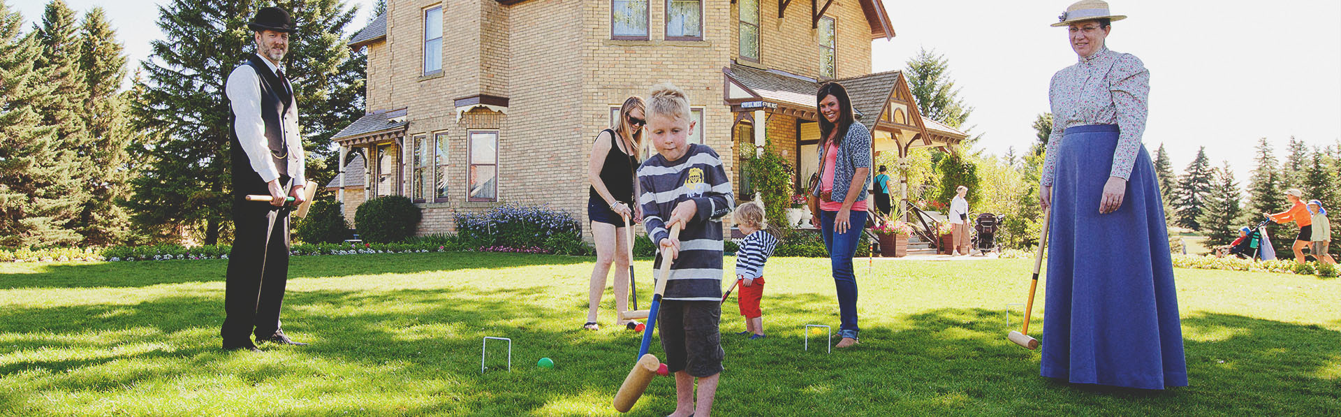 family playing croquet at Heritage Park