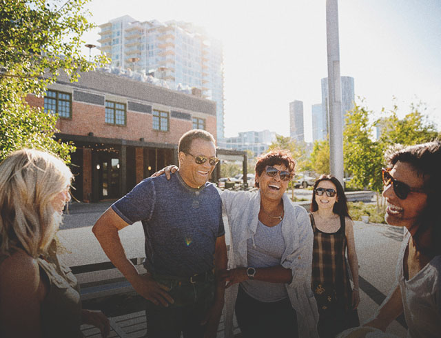 Group standing in front of the Simmons building in East Village
