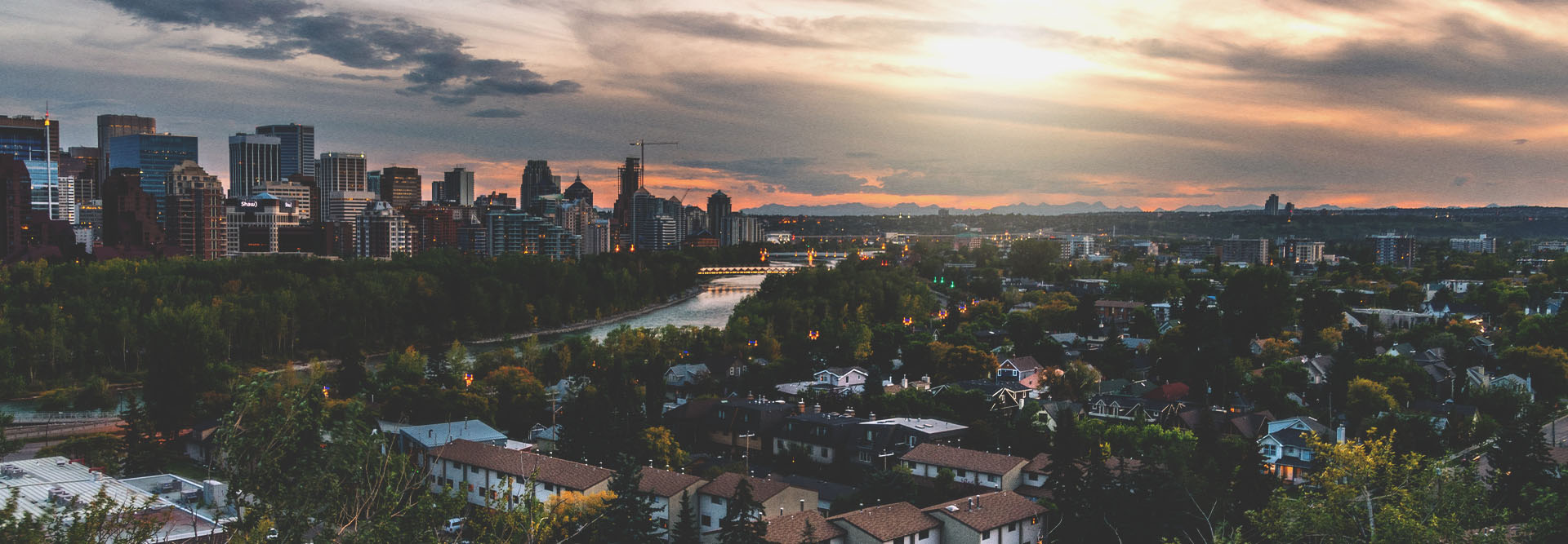 Aerial overlooking Sunnyside with the skyline and sunset in the background