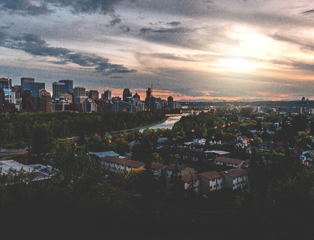 Aerial overlooking Sunnyside with the skyline and sunset in the background