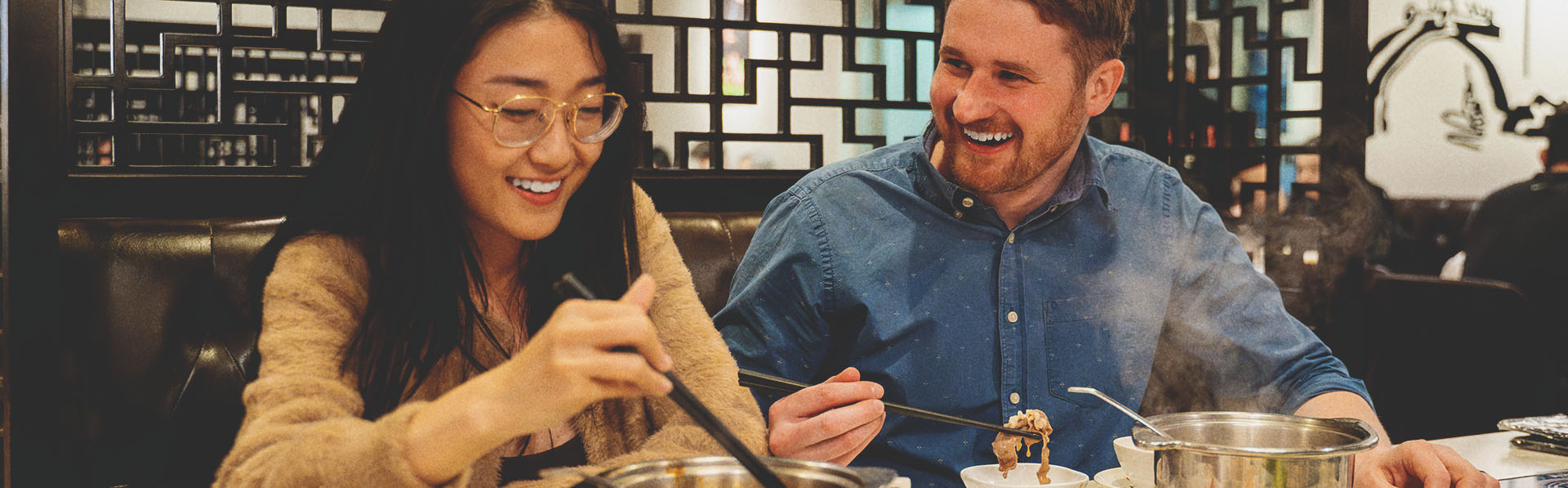 couple eating at Chine Hot Pot Noodles