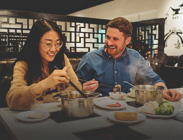 couple eating at Chine Hot Pot Noodles