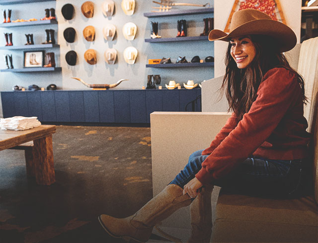 woman trying on custom boots at Alberta Boot Factory