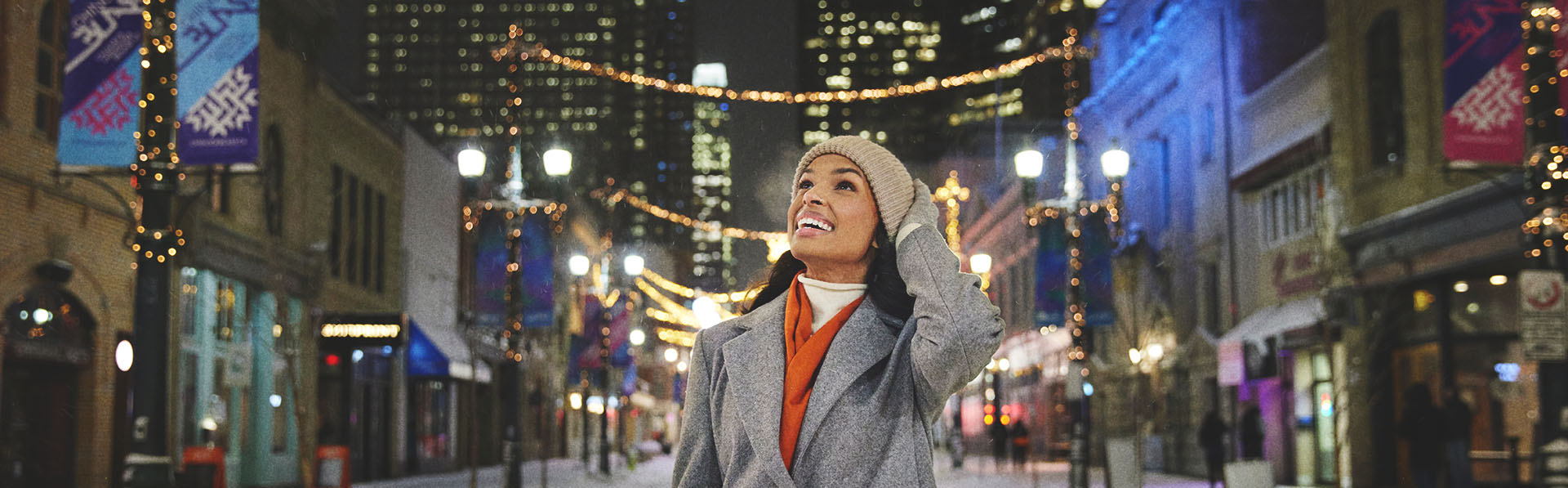 woman walking along Stephen Avenue in downtown Calgary during winter