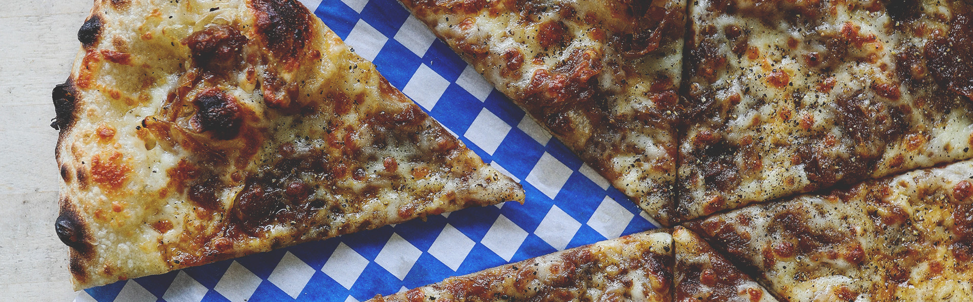 pizza with a slice removed from Pizza Face in Calgary