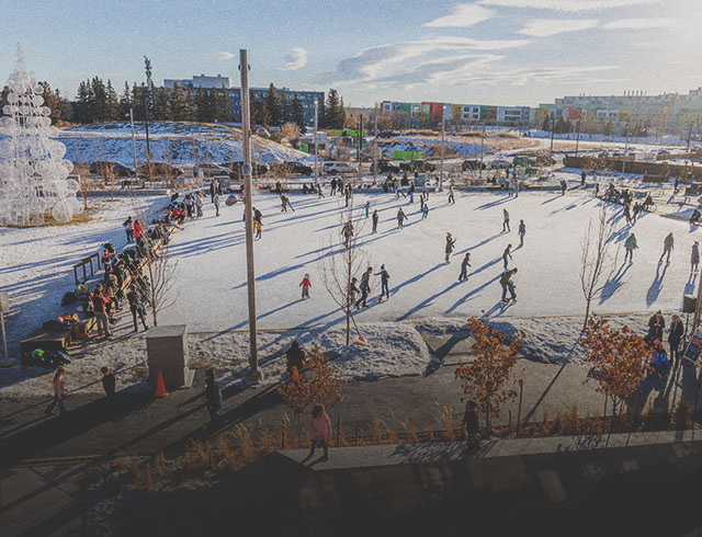 people outdoor ice skating at Central Commons Park in University District