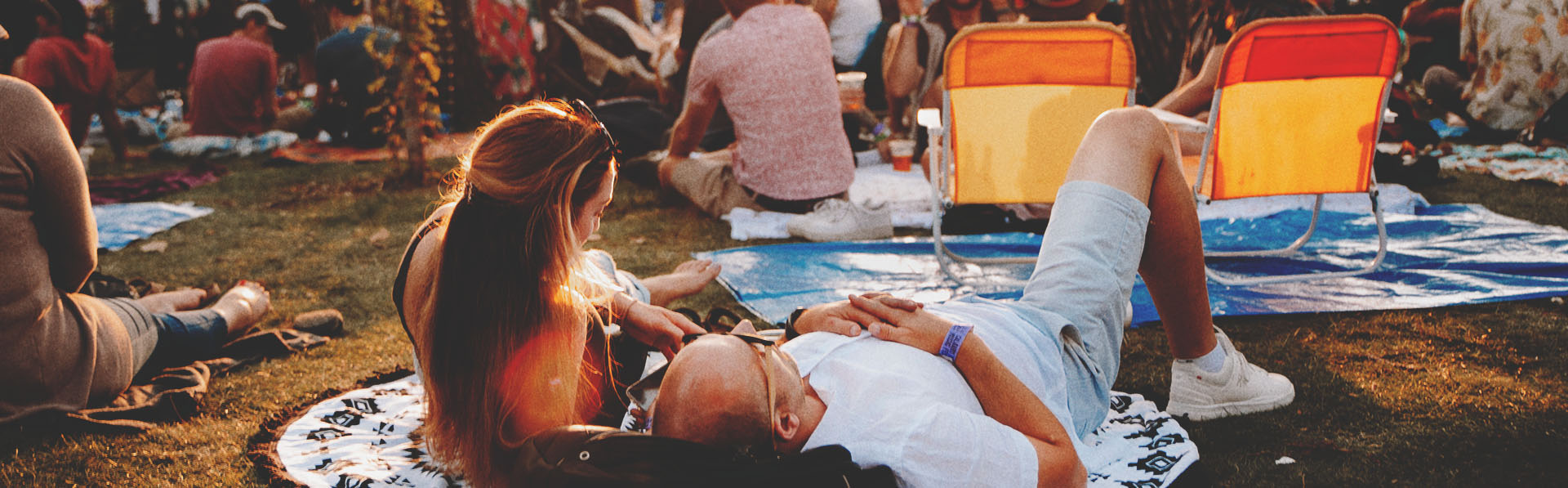 couple enjoying the Calgary Folk Music Festival in Prince's Island Park