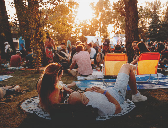 couple enjoying the Calgary Folk Music Festival in Prince's Island Park