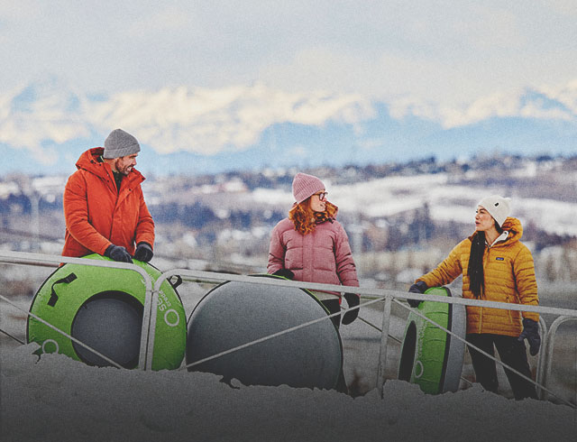 a group of friends tubing at Winsport Calgary