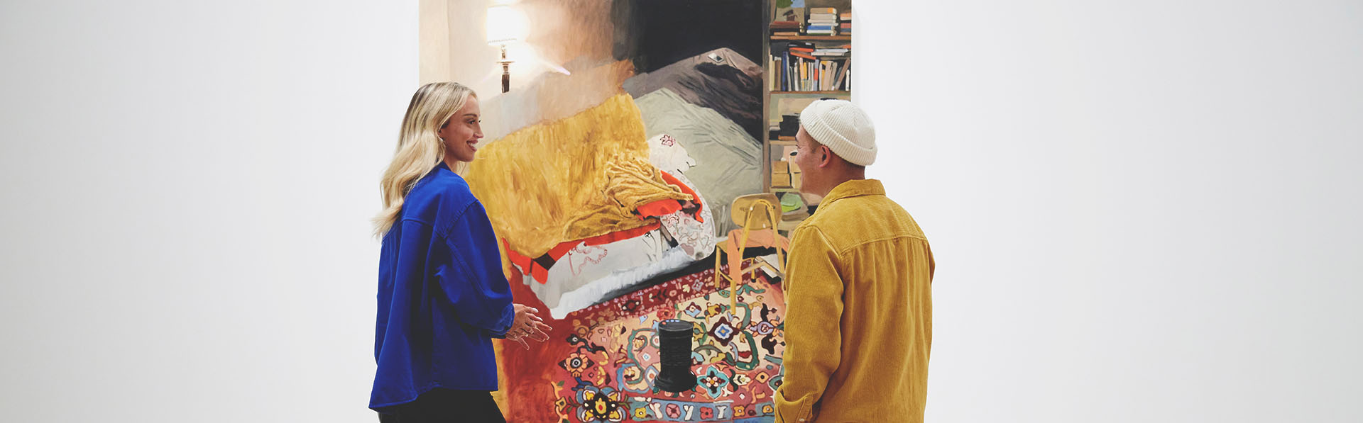two people talking in front of an artwork at the Esker Foundation