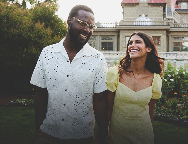 couple smiling in front of the Lougheed House