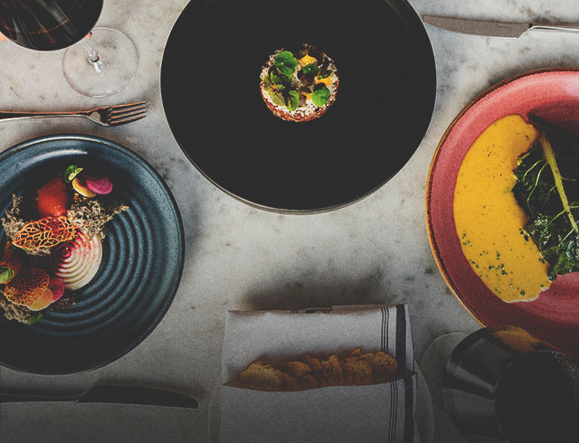 Table with dishes of food at The Wilde on 27
