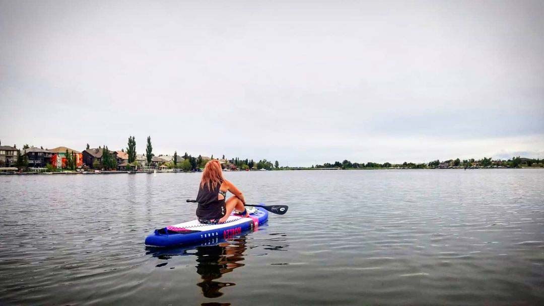 Women paddle boarding on Chestermere Lake 