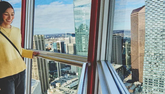 Woman walking on the Calgary Tower's glass floor