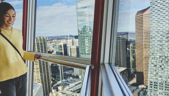 Woman looking out from the Calgary Tower 