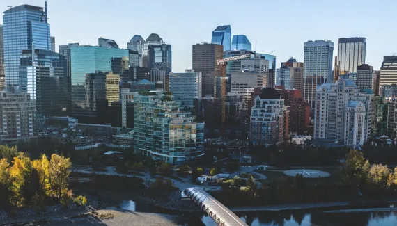 downtown Calgary skyline overlooking the Bow River and Peace Bridge