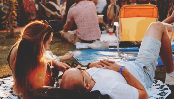 couple enjoying the Calgary Folk Music Festival in Prince's Island Park