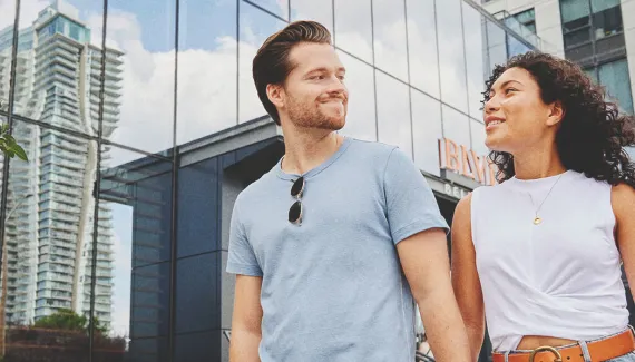 couple walking hand in hand in the Beltline
