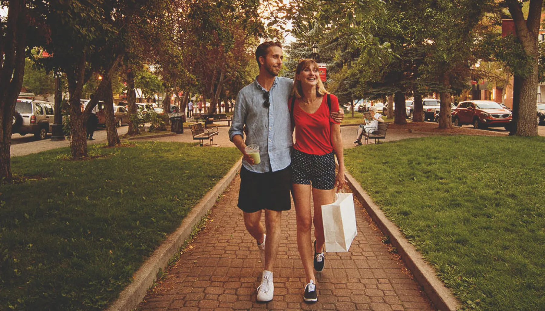 couple walking through Tomkins Park on 17th Avenue