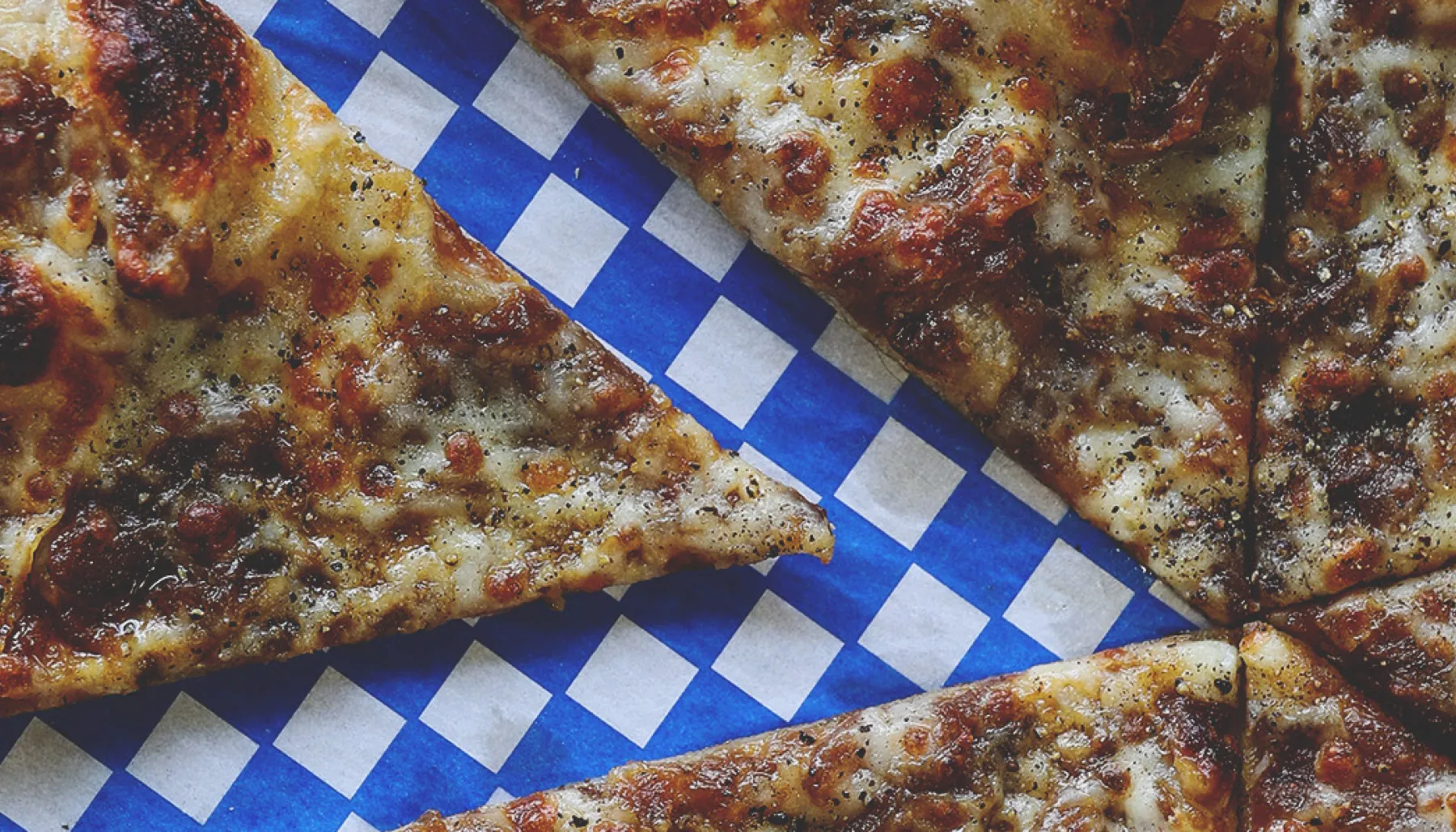 pizza with a slice removed from Pizza Face in Calgary