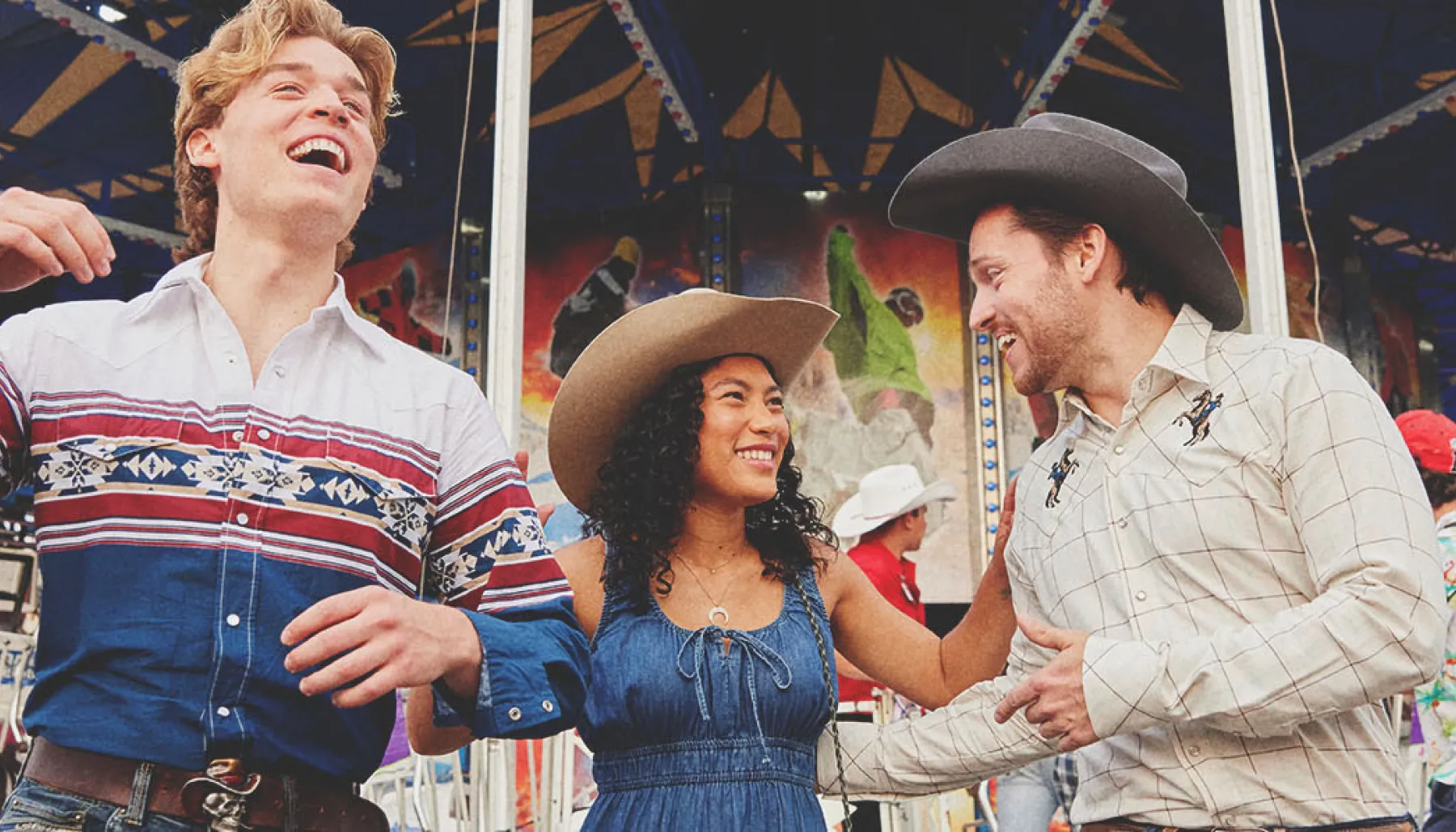 three friends exploring the Calgary Stampede midway