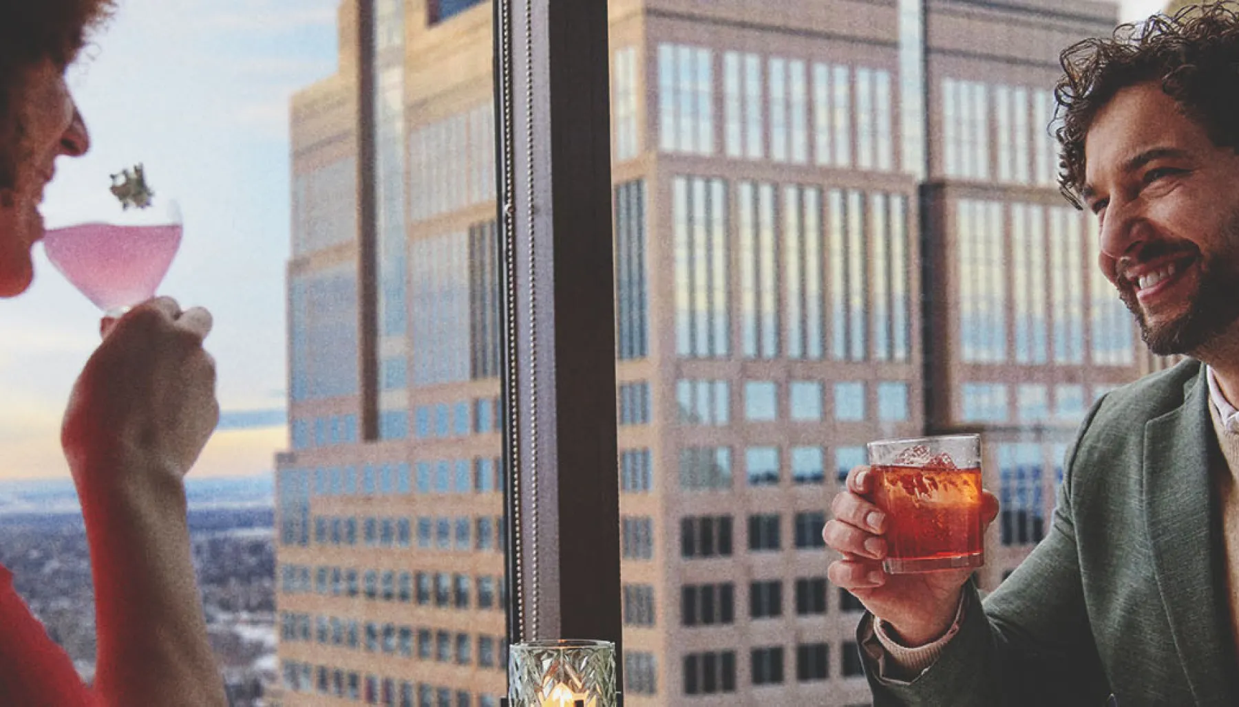 couple dining at Major Tom beside panoramic skyline views