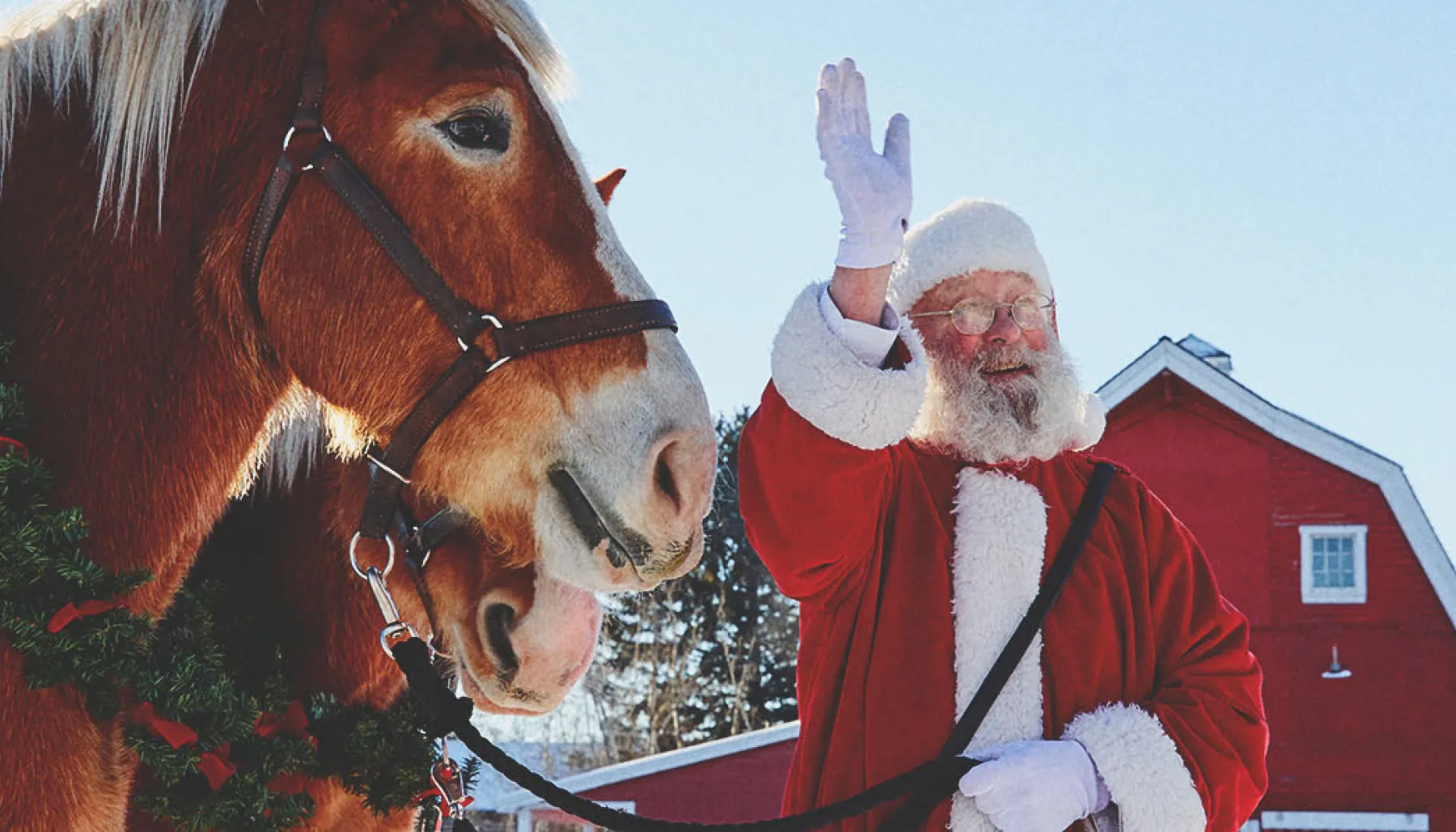 Santa is with horses at Heritage Park in Calgary