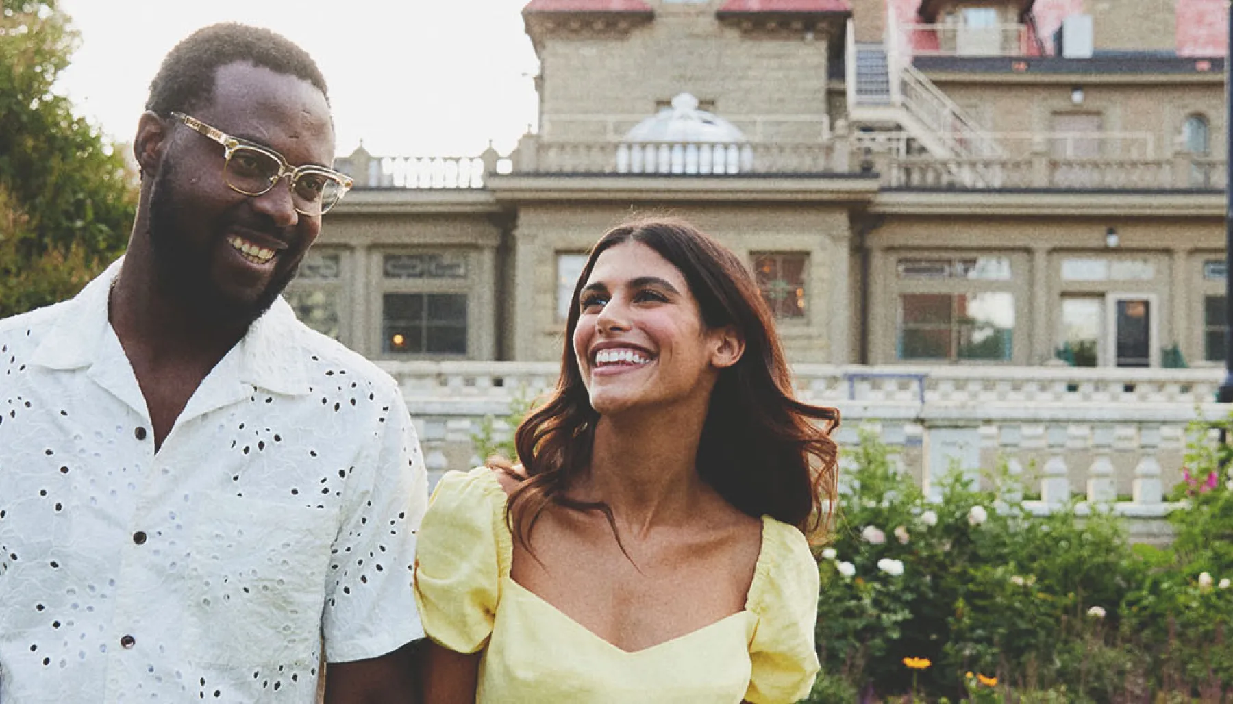 couple smiling in front of the Lougheed House