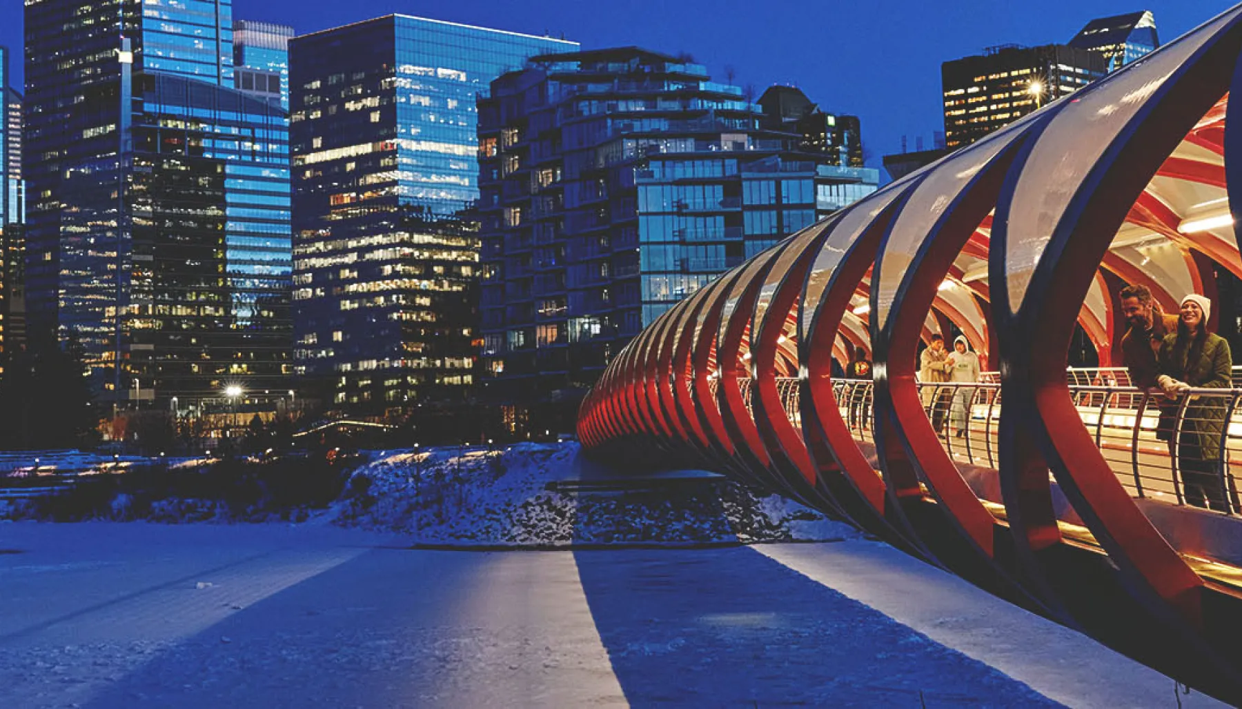 two people are standing on Peace Bridge