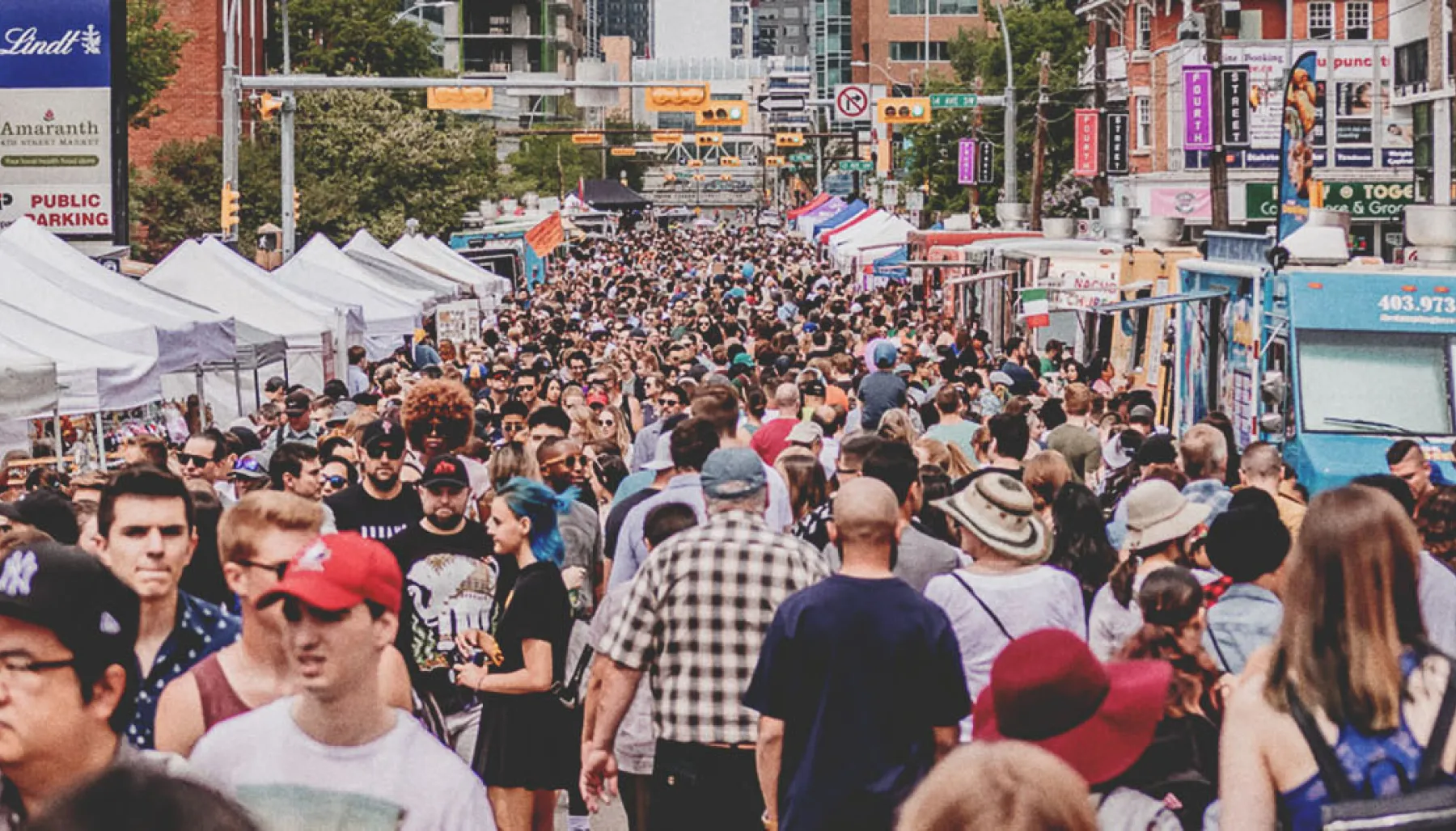 Crowds fill 4th Street during Calgary’s Lilac Festival on a sunny day