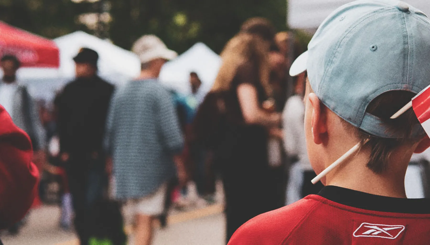 A little boy with a Canadian flag celebrating Canada Day