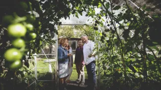 group on a tour of the gardens at Rouge Restaurant