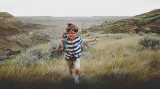 Child looking for dinosaurs in the Alberta Badlands
