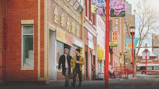 Couple walking through Calgary's Chinatown in winter