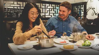 couple eating at Chine Hot Pot Noodles